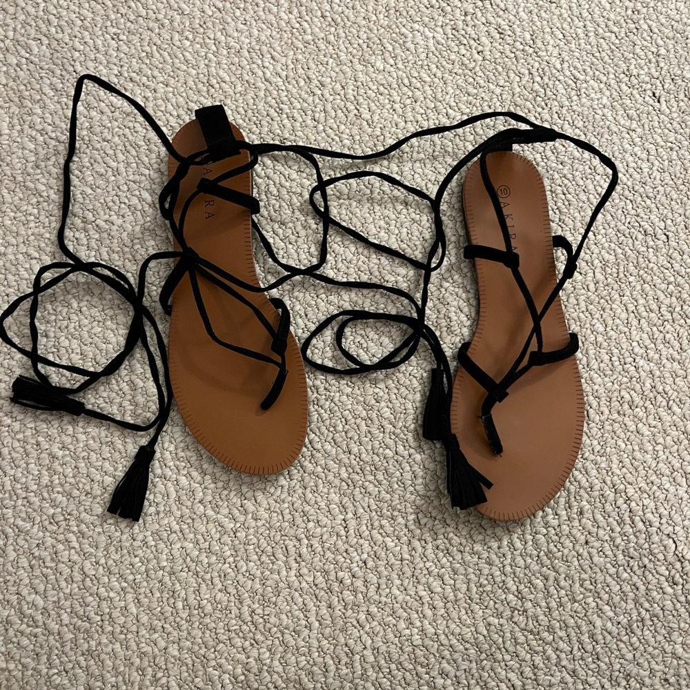 Akira Lace up sandals with tassel on end